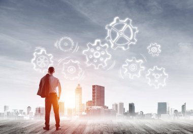 Modern şehre bakan ve vites düzeneği çizen işadamlarının arka planı