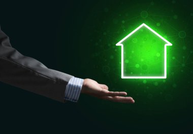 Koyu arkaplanda ev ya da ana sayfa simgesine elle işaret edilen kavramsal resim