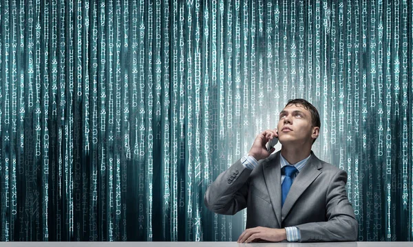 Young Man Talking Phone Looking Upward Businessman Sitting Desk Background — Stock Photo, Image