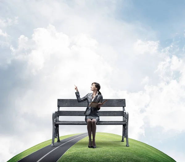 Young Woman Holding Open Book Sitting Wooden Bench Outdoors Beautiful — Stock Photo, Image