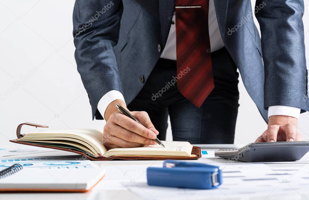Close-up businessman hand writing to do list