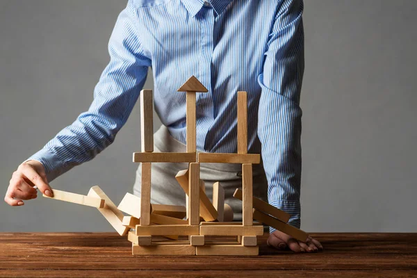 Business woman building tower on table — Stock Photo, Image