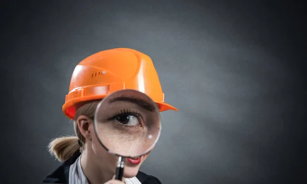 Technical inspector looking through magnifier — Stock Photo, Image