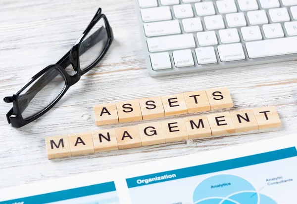 Asset management concept with letters on cubes — Stock Photo, Image