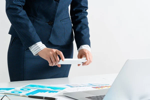 Businesswoman doing photo of document