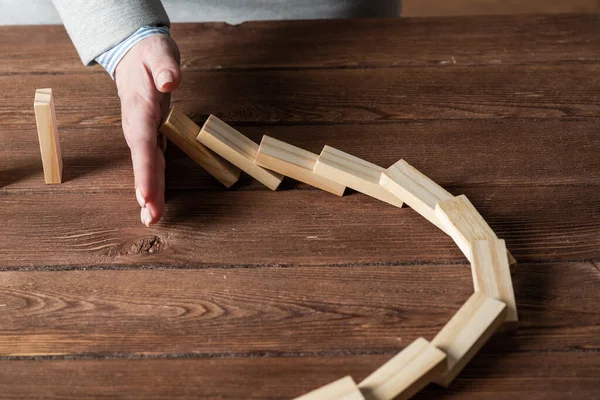 Business woman block domino effect. — Stock Photo, Image