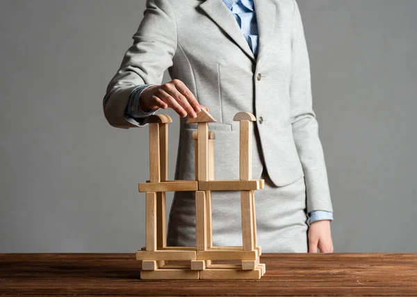 Business woman building construction on table — Stock Photo, Image