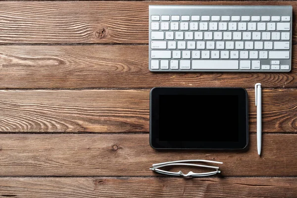 Top view of office workspace with gadgets