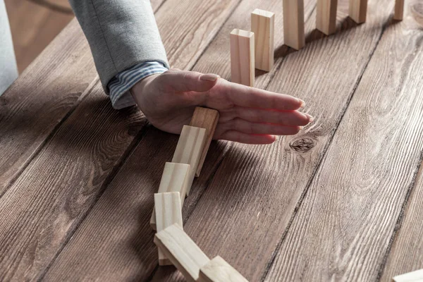 Business woman block domino effect. — Stock fotografie