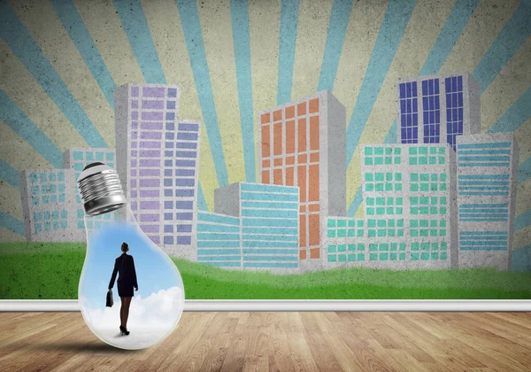 Businesswoman trapped in bulb — Stock Photo, Image