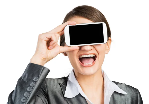 Mujer cubriendo sus ojos con un smartphone — Foto de Stock
