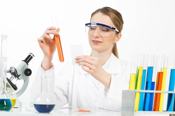 Laboratory assistant conducts experiment concept Stock Photo