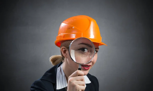 Technical inspector looking through magnifier — Stock Photo, Image