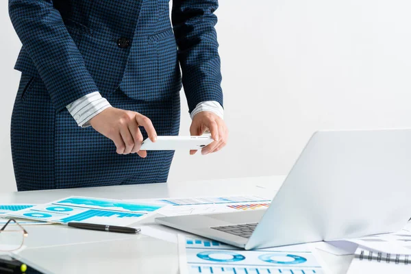 Businesswoman doing photo of document