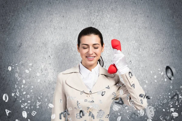 Smiling Young Woman Holding Retro Red Phone Flying Various Letters — Stock Photo, Image