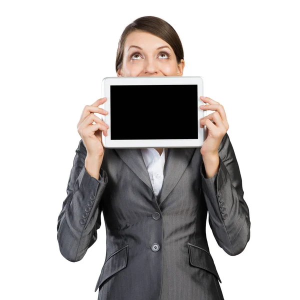 Businesswoman with tablet computer looking upwards — Stock Photo, Image