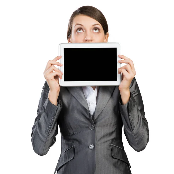 Бизнесмен с планшетным компьютером смотрит вверх — стоковое фото