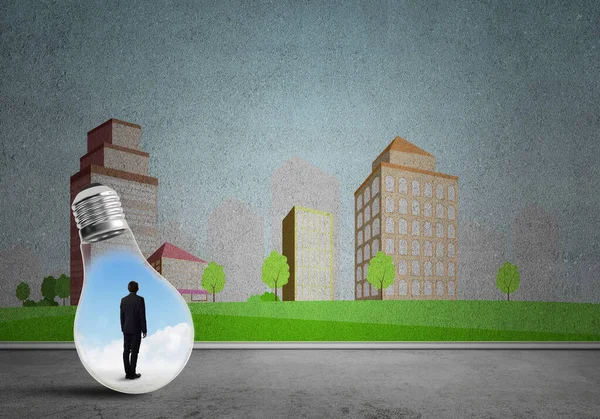 Businessman trapped in bulb — Stock Photo, Image