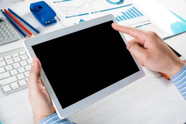 Businessman with a tablet, works in the office — Stock Photo, Image