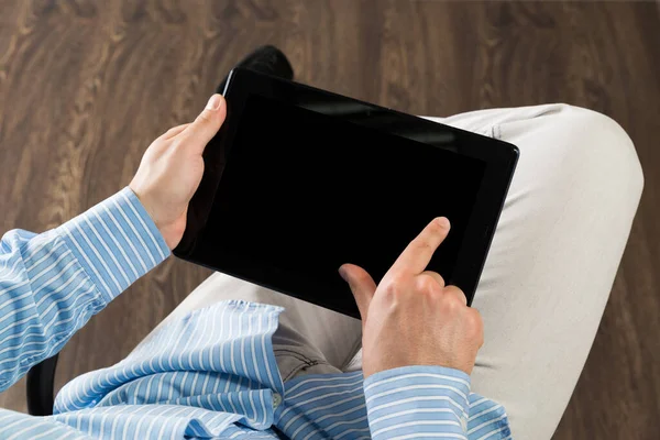 businessman with a tablet, works in the office