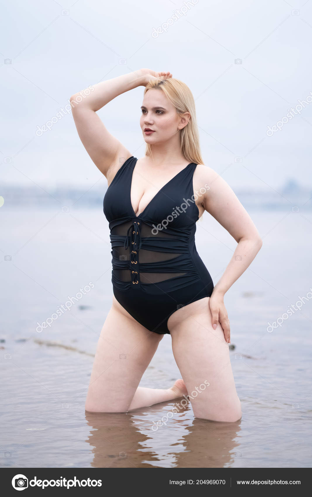 Beautiful Curvy Caucasian Girl Big Breasts Striped Swimsuit Stands
