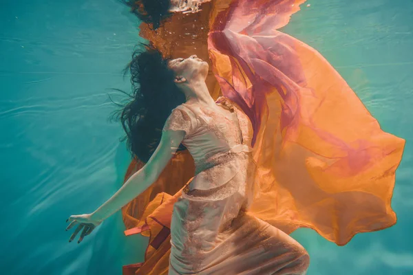 Girl Orange Dress Dreamy Meditative Floating Water Soul Reincarnation — Stock Photo, Image