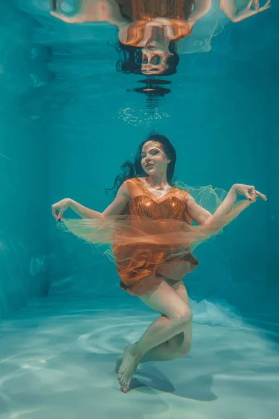 Beautiful Model Girl Swims Underwater Orange Dress Enjoys Relaxation Lack — Stock Photo, Image