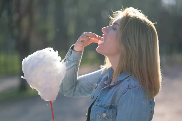 Charming Caucasian Girl Walks Spring Park Denim Jacket Eats Pink — Stock Photo, Image