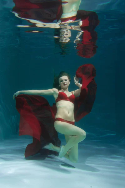 Pretty Caucasian Long Hair Woman Swimming Underwater Red Sexy Lingerie Royalty Free Stock Images