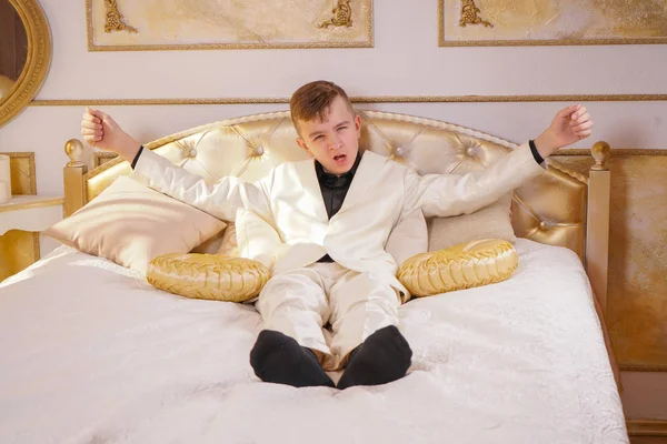 Young Teen Guy Wearing White Business Suit Lying Bed His — Stock Photo, Image