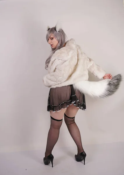 pretty plump woman wearing sexy lingerie dress and black stockings with furry anime ears and big fluffy tail on white background