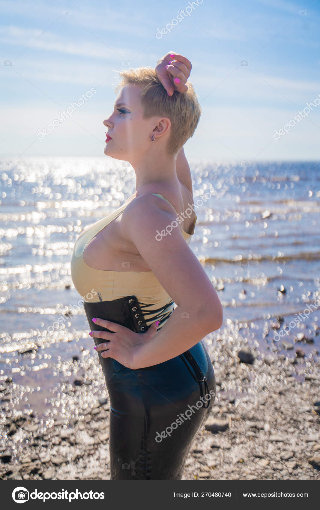 Photo of sexy cute caucasian woman withflour on slim body in kitchen Photo of sexy cute caucasian woman withflour on slim body in kitchen