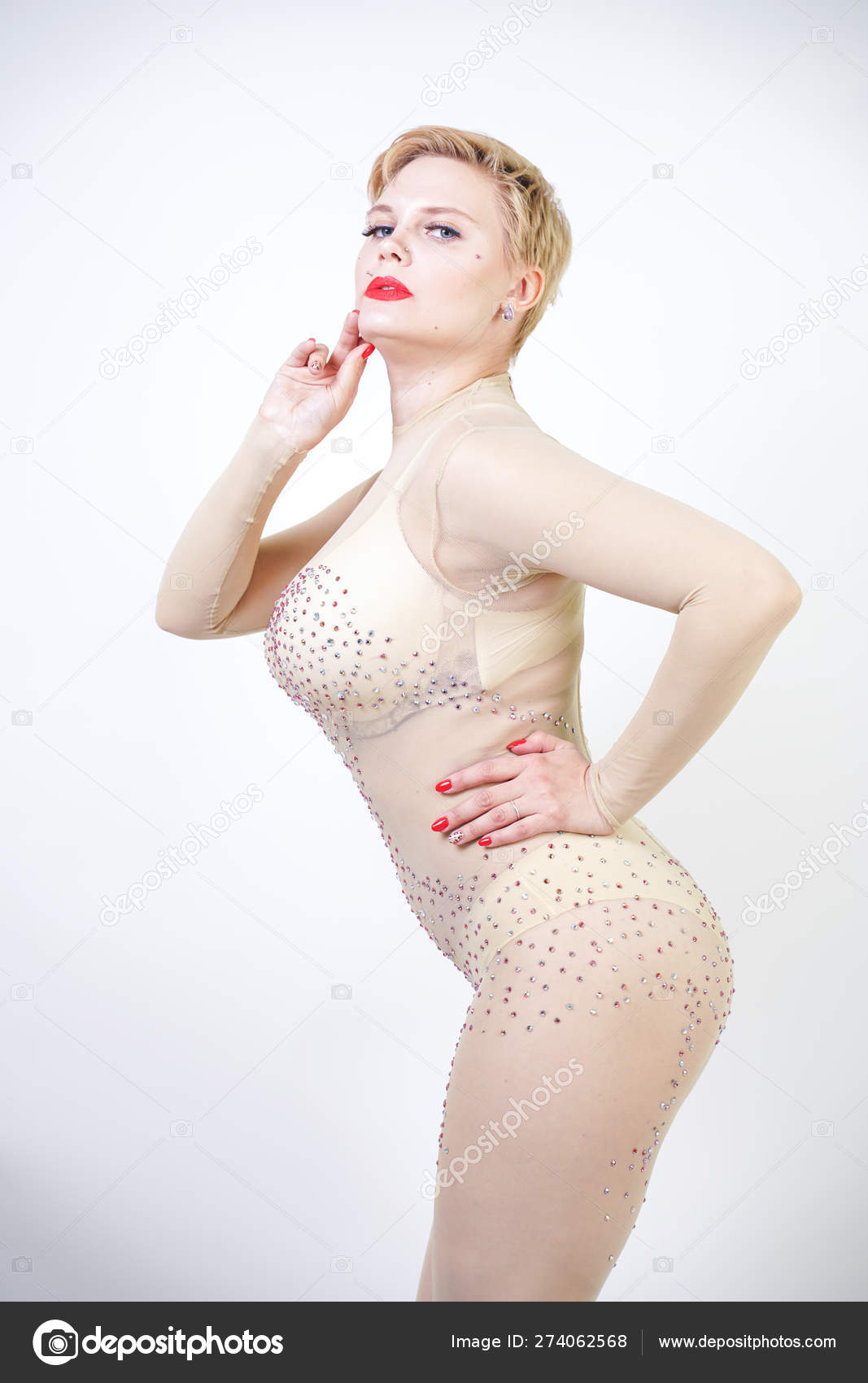 Mature woman in sexy lingerie showing herself from behind a tall chair Mature woman in sexy lingerie showing herself from behind a tall chair