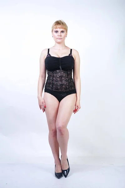 Plus Size Woman with Short Hair in Blue and Black Lace Corset