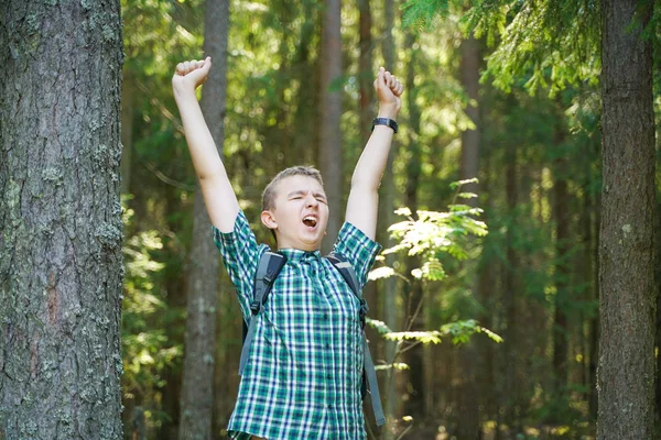 Teenager boy walking in the forest alone in the summer day — Stock Photo, Image
