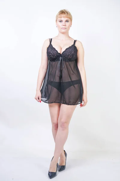 Hot chubby woman wearing lingerie transparent black dress — Stock Photo, Image