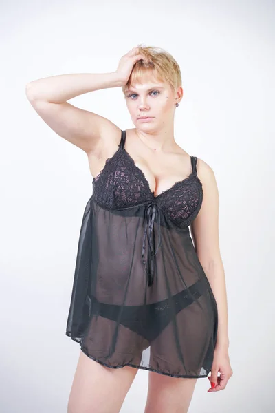 Hot chubby woman wearing lingerie transparent black dress — Stock Photo, Image