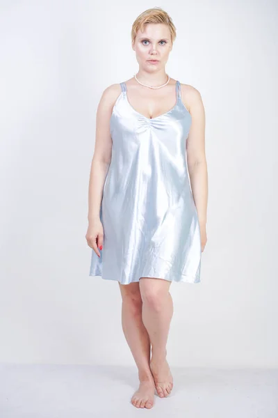 Sexy plus size beauty woman wear light blue silk dress — Stock Photo, Image