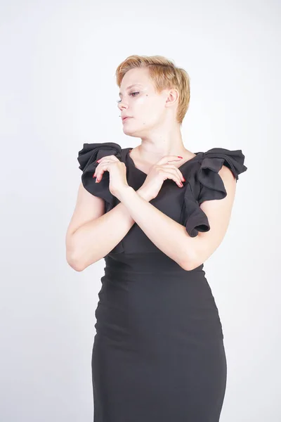 Portrait of attractive chubby young woman in tight black dress — Stock Photo, Image