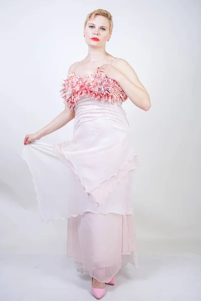 Portrait of short-haired plump woman in pink evening dress — Stock Photo, Image