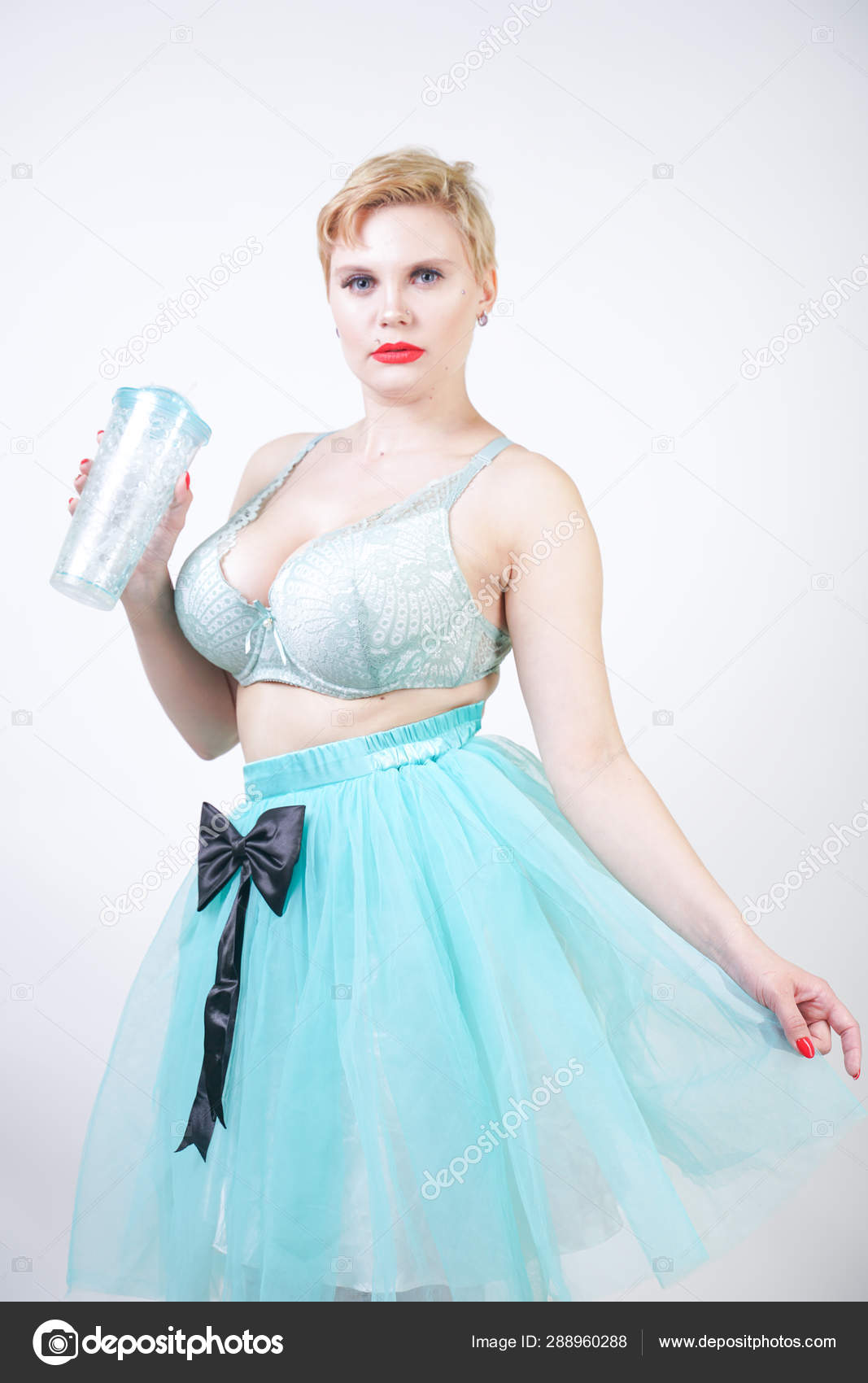 Plus Size Woman With Short Hair Wear Bra And Tutu Skirt Stock