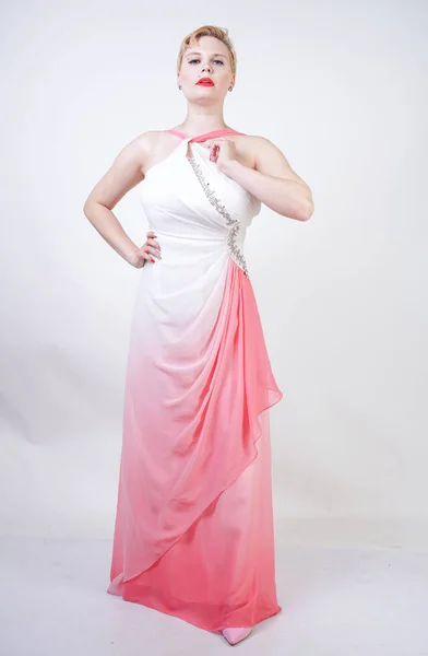 Portrait of short-haired plump woman in pink evening dress — Stock Photo, Image