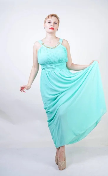 Curvy plus size woman in long mint blue dress — Stock Photo, Image