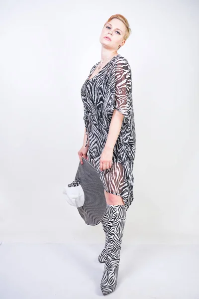 Attractive pretty woman wearing zebra dress in studio — Stock Photo, Image