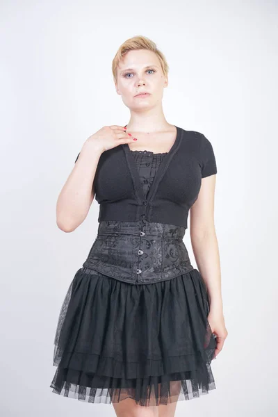 Portrait of beautiful girl in black corset goth dress — Stock Photo, Image