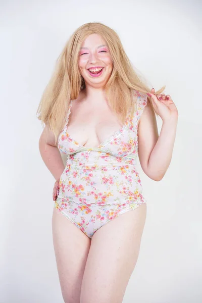 Plus size asian blonde girl in cute lingerie on white background — Stock Photo, Image