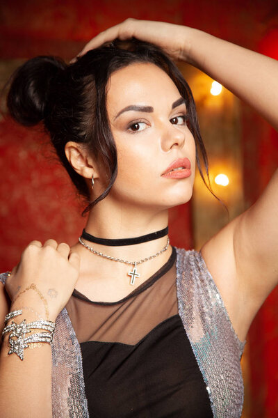 Fashion young woman with smooth armpit on red background