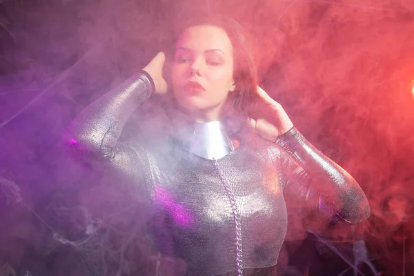 Futuristic Space fashion person in silver stylish outfit in the smoke — Stock Photo, Image
