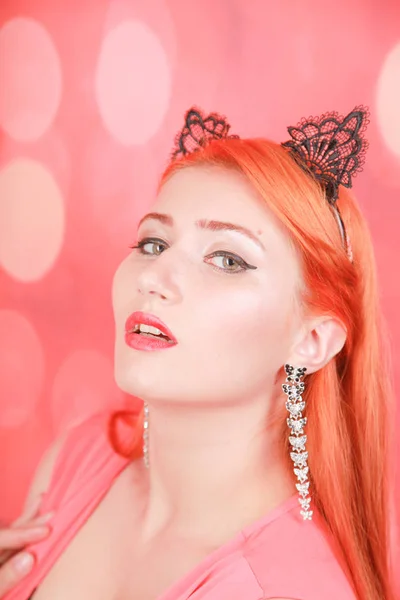 Beautiful redheaded young girl with fashion lace cat ears on head — Stock Photo, Image