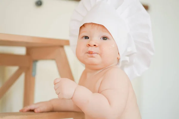 Little baby boy baker enjoying playing on the kitchen close up — Φωτογραφία Αρχείου